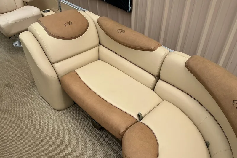 Slide: The Image of Luxurious seating on 2019 Avalon Catalina Quad Lounge, featuring beige and brown upholstery. - 3