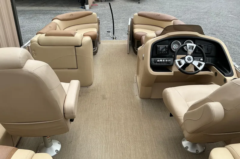 Slide: The Image of 2019 Avalon Catalina Quad Lounge interior with beige seating and modern dashboard. - 8