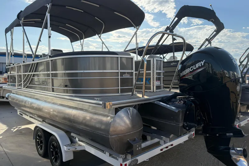 Slide: The Image of 2023 South Bay 224RS LE pontoon boat with Mercury engine on trailer. - 16