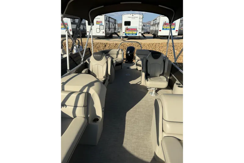 Slide: The Image of 2023 South Bay 224RS LE pontoon boat interior with beige seating and canopy. - 6