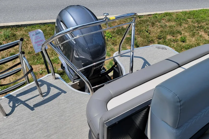 Slide: The Image of 2021 Godfrey Monaco 235 C boat with outboard motor and seating area. - 9