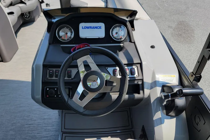 Slide: The Image of Steering console of 2021 Godfrey Monaco 235 C boat with Lowrance display. - 10