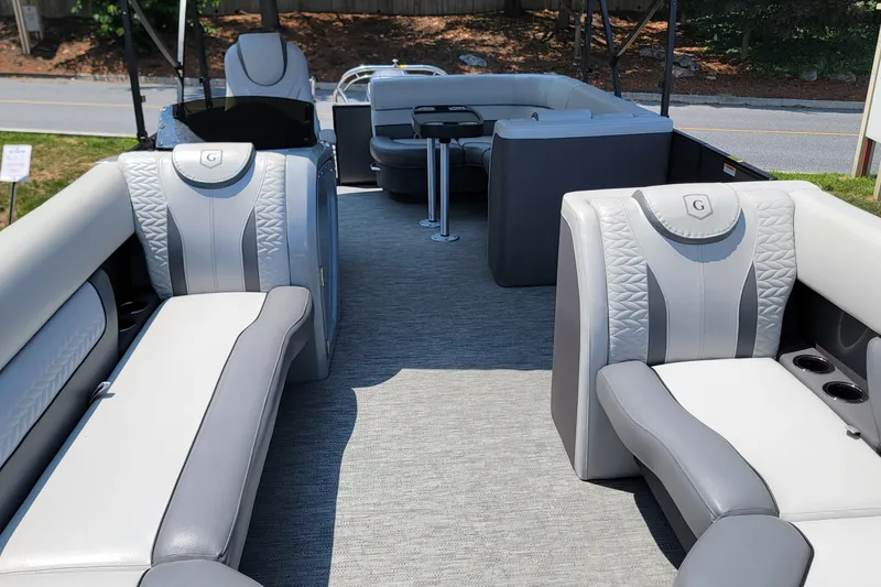Slide: The Image of 2021 Godfrey Monaco 235 C pontoon boat interior with luxurious seating and modern design. - 15