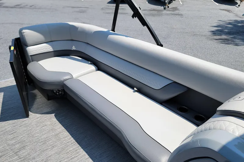 Slide: The Image of 2021 Godfrey Monaco 235 C pontoon boat interior with plush gray seating. - 12