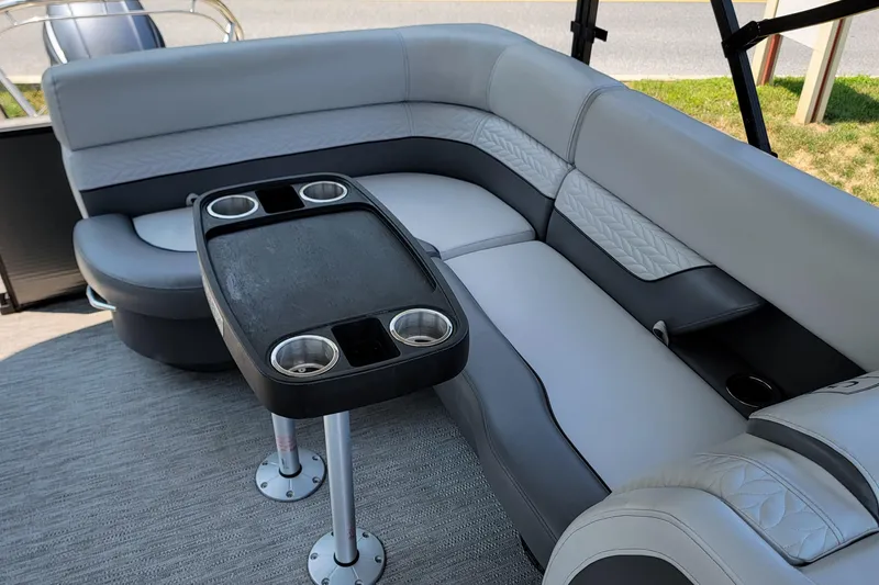 Slide: The Image of Luxurious seating area on 2021 Godfrey Monaco 235 C pontoon boat with cup holders. - 8
