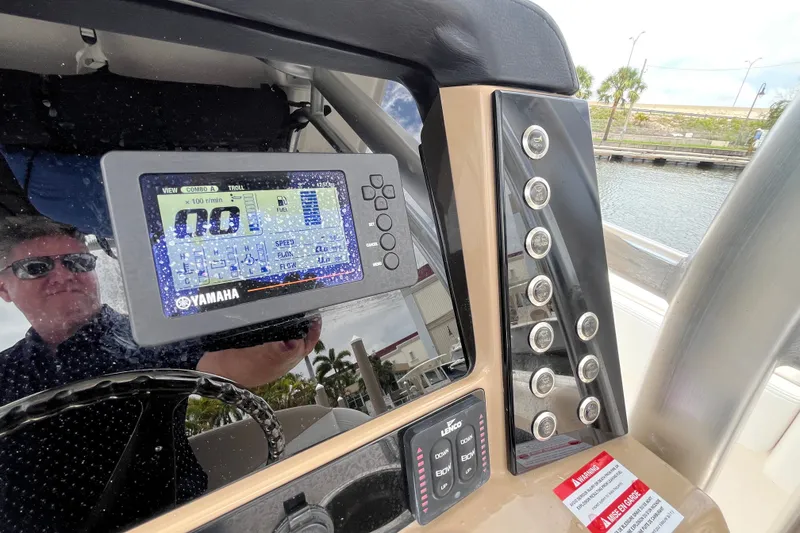 Slide: The Image of 2019 Robalo R242 Center Console dashboard with Yamaha display and control panel. - 20