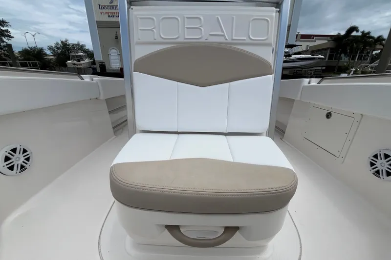 Slide: The Image of 2019 Robalo R242 Center Console boat seat with beige and white upholstery. - 22