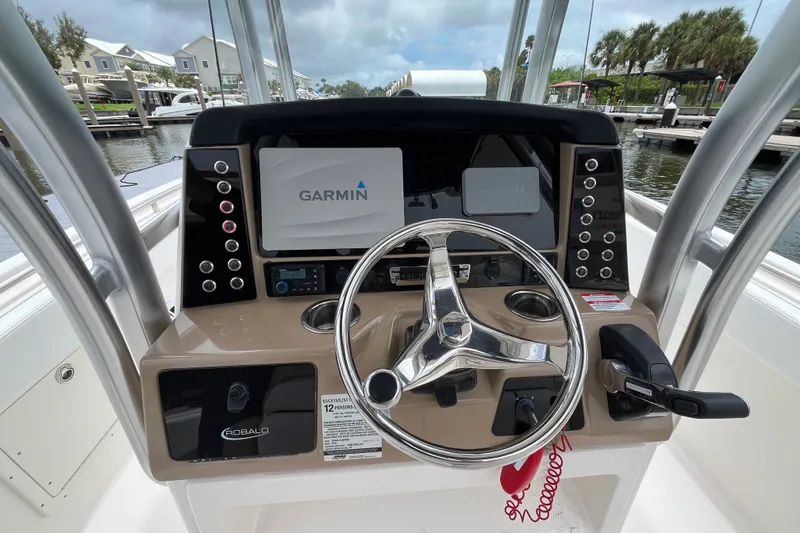 Slide: The Image of 2019 Robalo R242 Center Console boat dashboard with Garmin navigation system. - 11