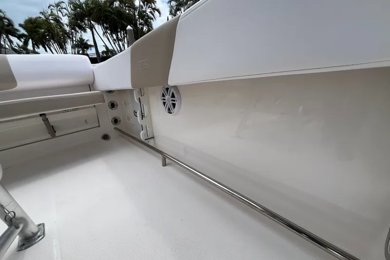 Slide: The Image of 2019 Robalo R242 Center Console boat interior with seating and stainless steel railings. - 16