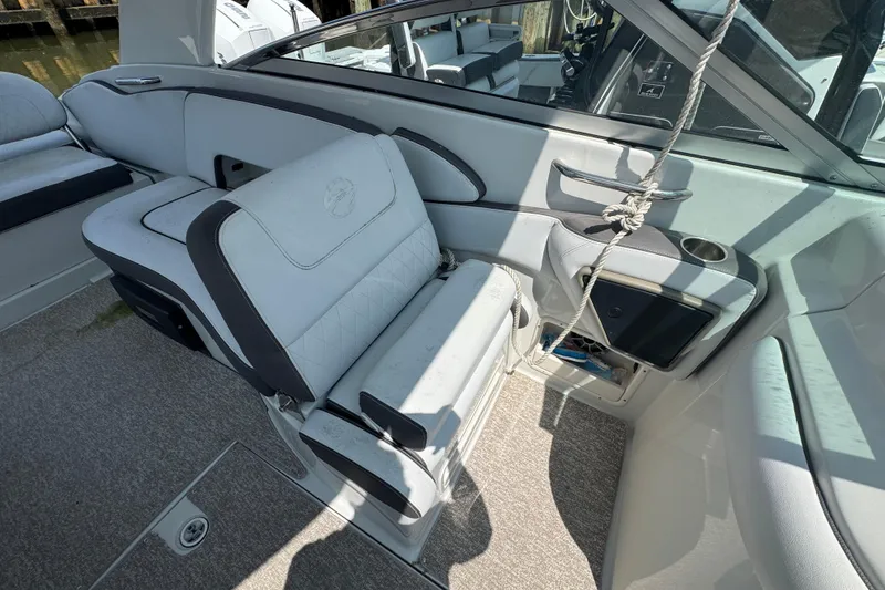 Slide: The Image of 2018 Crownline Eclipse E30 boat interior with plush seating and modern design. - 15