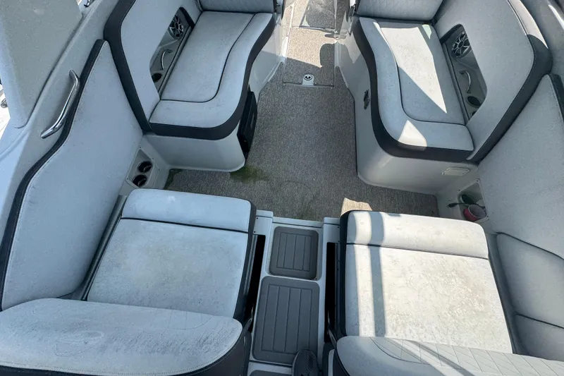 Slide: The Image of Interior seating of 2018 Crownline Eclipse E30 boat, featuring spacious, cushioned benches. - 5