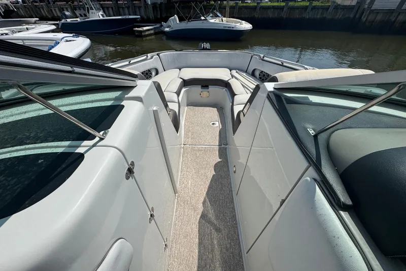 Slide: The Image of 2018 Crownline Eclipse E30 boat interior with spacious seating and sleek design. - 17