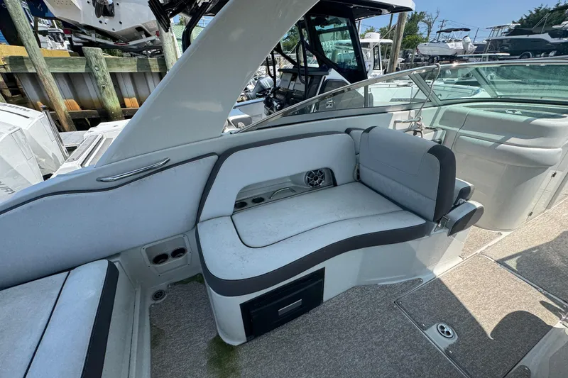 Slide: The Image of 2018 Crownline Eclipse E30 boat interior with cushioned seating and modern design. - 8