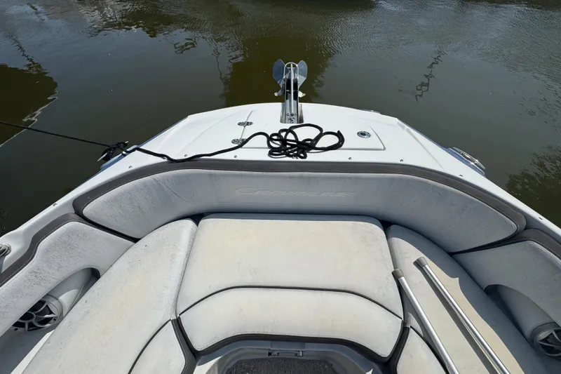 Slide: The Image of Bow seating area of a 2018 Crownline Eclipse E30 boat on water. - 20