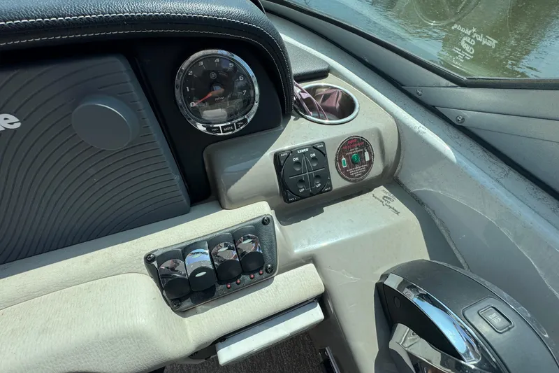 Slide: The Image of Dashboard of a 2018 Crownline Eclipse E30 boat with controls and gauges. - 13