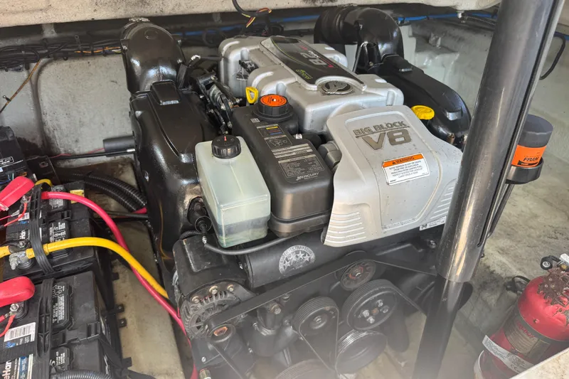Slide: The Image of 2018 Crownline Eclipse E30 engine compartment with Big Block V8 engine and battery setup. - 22