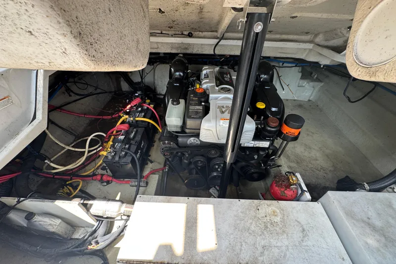 Slide: The Image of Engine compartment of a 2018 Crownline Eclipse E30 boat, showcasing wiring and components. - 23