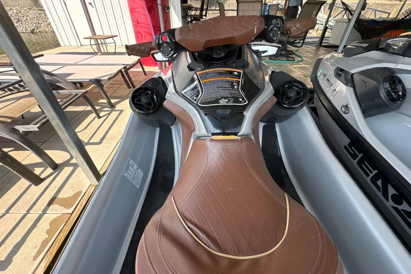 Slide: The Image of 2018 Sea-Doo GTX Limited 230 jet ski with brown seat and control panel. - 5