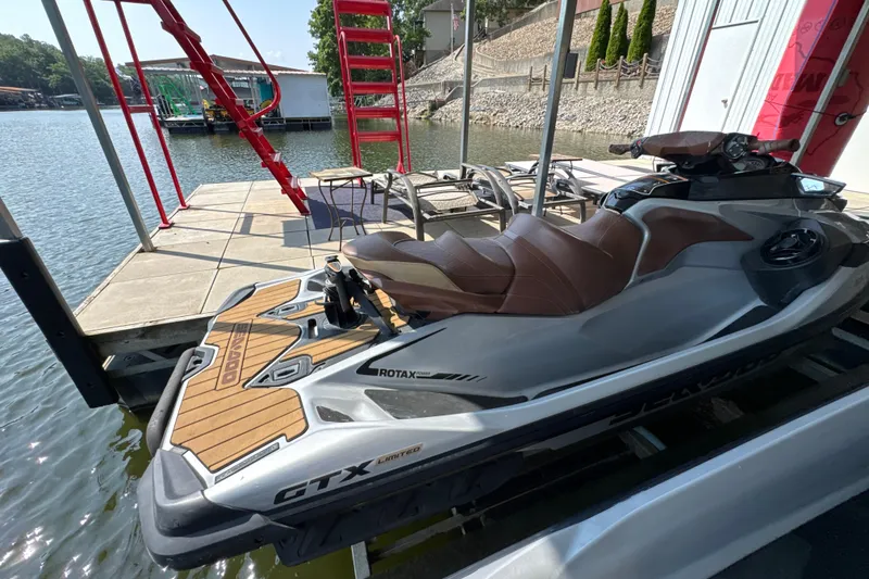 Slide: The Image of 2018 Sea-Doo GTX Limited 230 jet ski docked by a lakeside pier. - 4