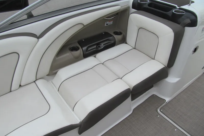 Slide: The Image of 2013 Yamaha Boats 242 Limited S interior seating with cup holders and sleek design. - 8