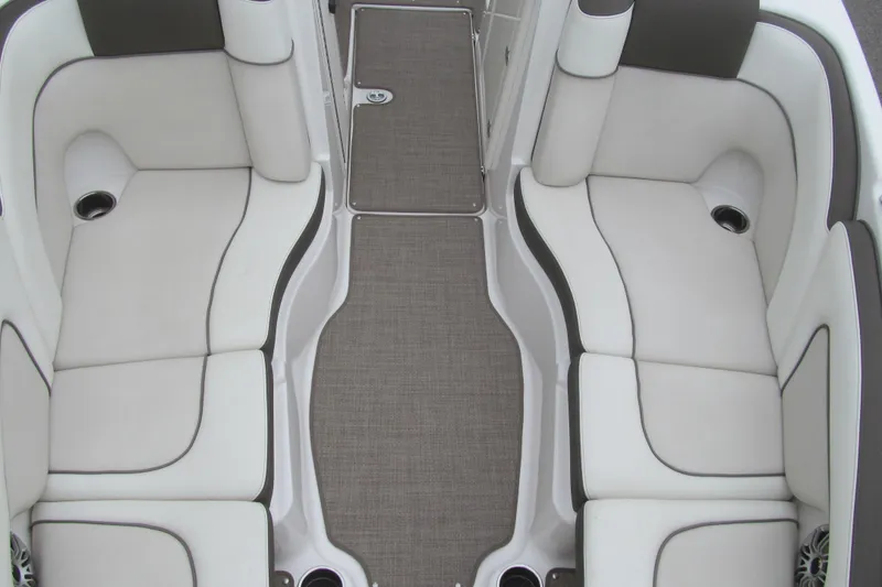 Slide: The Image of 2013 Yamaha Boats 242 Limited S interior seating with white and gray upholstery. - 11