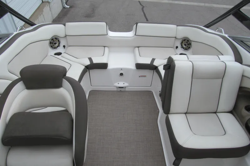 Slide: The Image of 2013 Yamaha Boats 242 Limited S interior with white and gray seating. - 13
