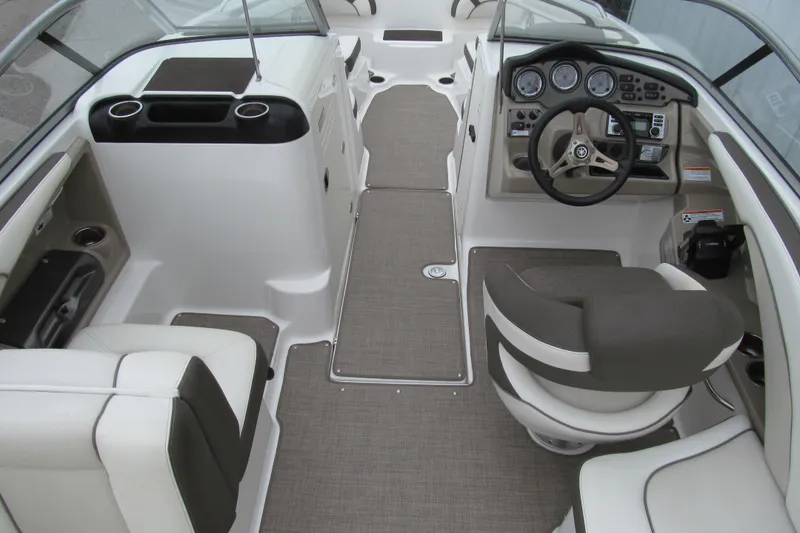 Slide: The Image of 2013 Yamaha Boats 242 Limited S interior with steering wheel and seating area. - 5