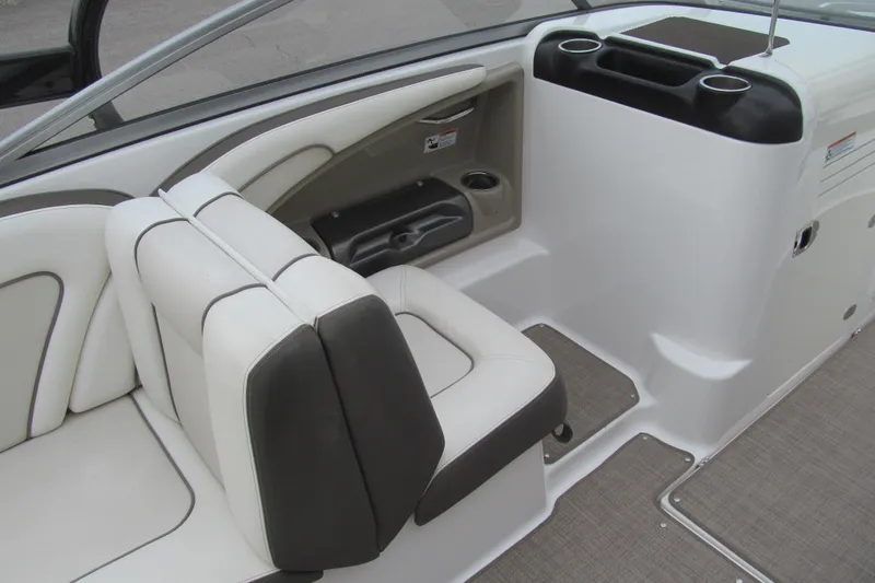 Slide: The Image of Interior seating of 2013 Yamaha Boats 242 Limited S, featuring sleek design and cup holders. - 7