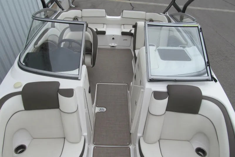 Slide: The Image of 2013 Yamaha Boats 242 Limited S interior with plush seating and sleek design. - 12
