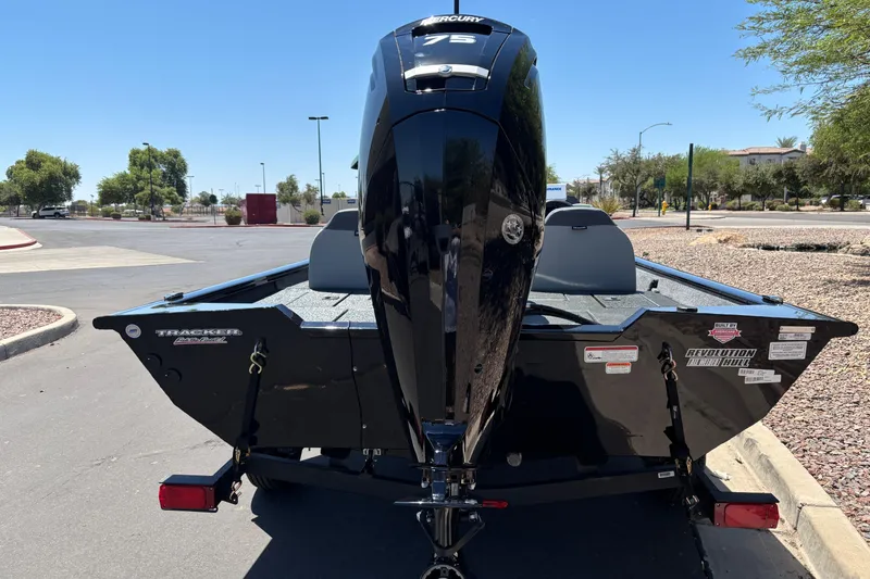Slide: The Image of 2027 Tracker Pro Team 175 boat with Mercury 75 engine, parked outdoors. - 2