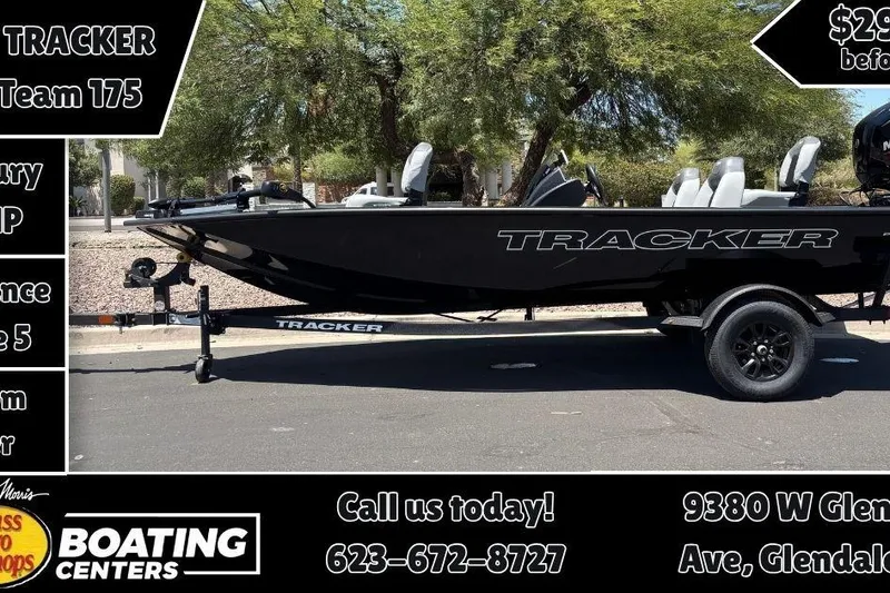 Slide: The Image of 2027 Tracker Pro Team 175 boat on trailer, displayed at a boating center. - 9
