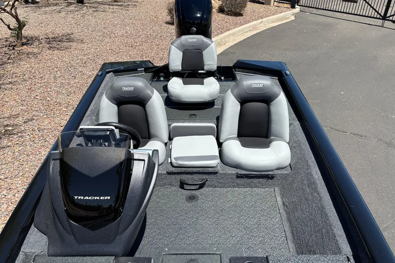 Slide: The Image of 2027 Tracker Pro Team 175 boat interior with three seats and steering console. - 5