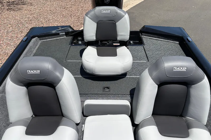 Slide: The Image of 2027 Tracker Pro Team 175 boat interior with three gray and black seats. - 6