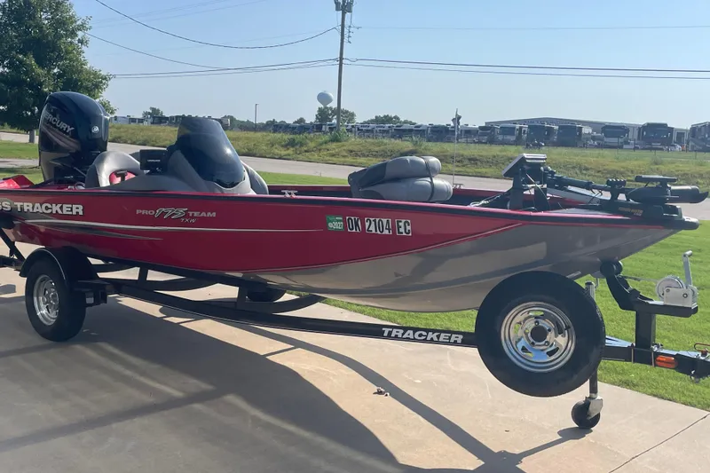 Slide: The Image of 2015 Tracker Pro Team 175 TXW boat on trailer, parked outdoors on a sunny day. - 3