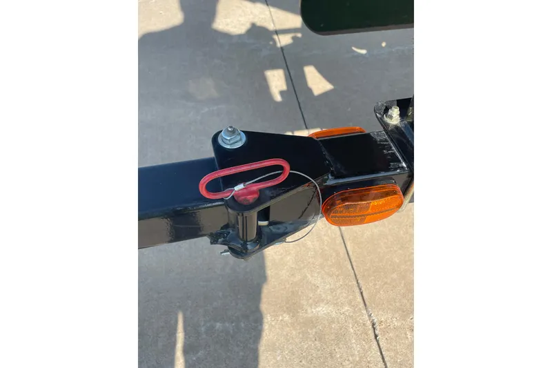 Slide: The Image of Trailer hitch of 2015 Tracker Pro Team 175 TXW with safety pin and reflectors. - 11