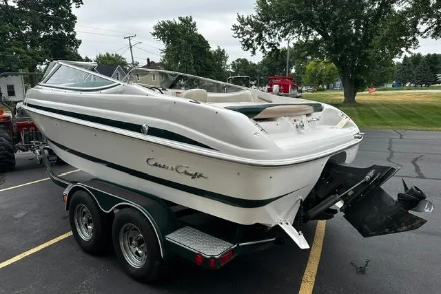 Slide: The Image of 1999 Chris-Craft 200 Bowrider SS on trailer, parked outdoors. - 6