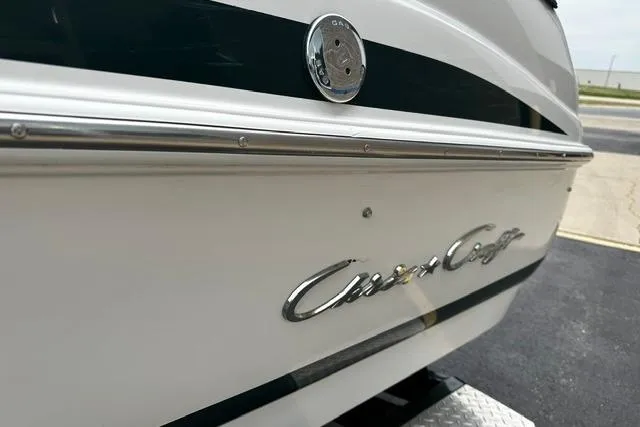 Slide: The Image of 1999 Chris-Craft 200 Bowrider SS boat, close-up of logo and exterior detailing. - 8
