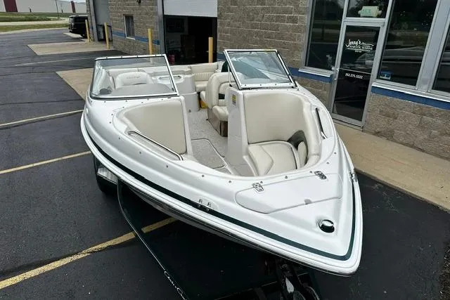 Slide: The Image of 1999 Chris-Craft 200 Bowrider SS boat parked outside a building. - 3