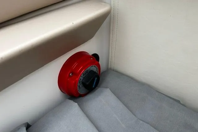 Slide: The Image of Red battery switch on 1999 Chris-Craft 200 Bowrider SS boat interior. - 26