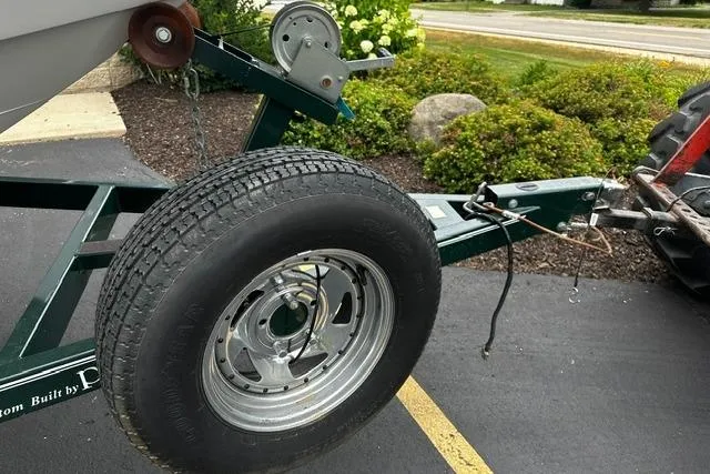 Slide: The Image of Trailer hitch and wheel for 1999 Chris-Craft 200 Bowrider SS boat. - 34