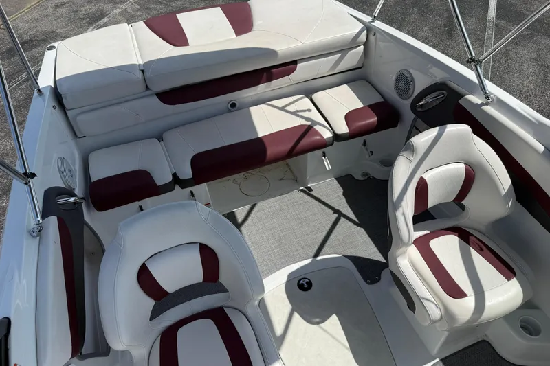 Slide: The Image of 2020 Tahoe 500 TS boat interior with white and maroon seating, featuring modern design. - 23