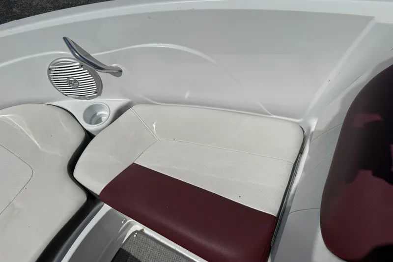 Slide: The Image of Interior seating of a 2020 Tahoe 500 TS boat with maroon and white upholstery. - 20