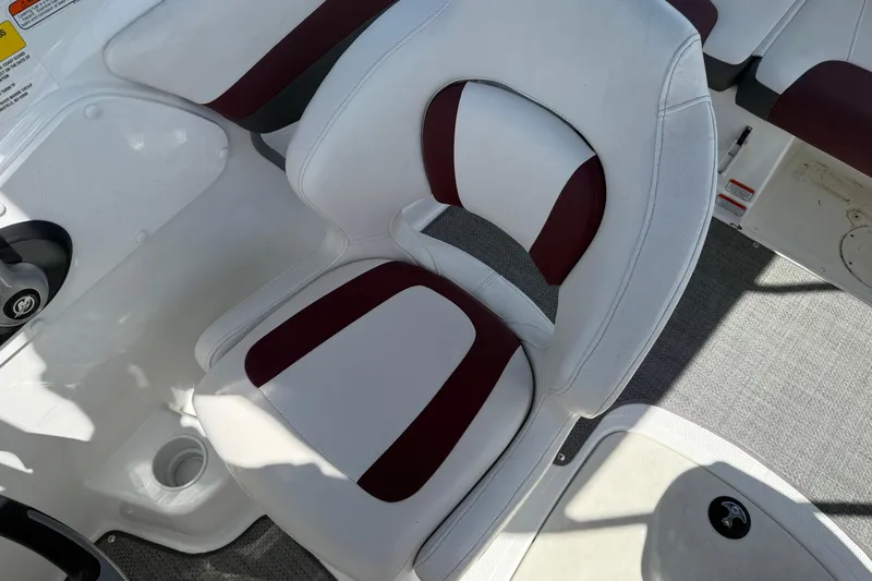 Slide: The Image of Captain's seat on a 2020 Tahoe 500 TS boat, featuring white and maroon upholstery. - 12