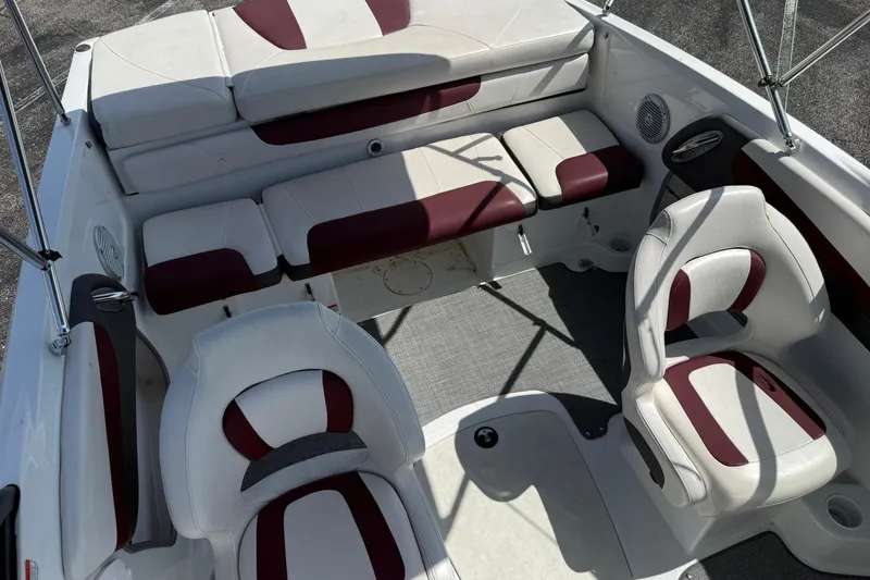 Slide: The Image of Interior of 2020 Tahoe 500 TS boat with white and maroon seating. - 22