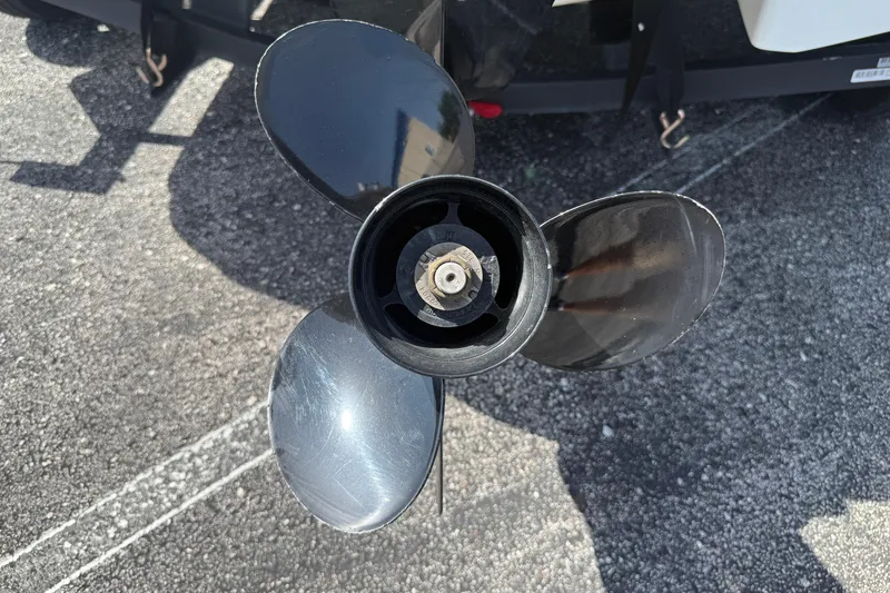 Slide: The Image of Close-up of a 2020 Tahoe 500 TS boat propeller on asphalt surface. - 6