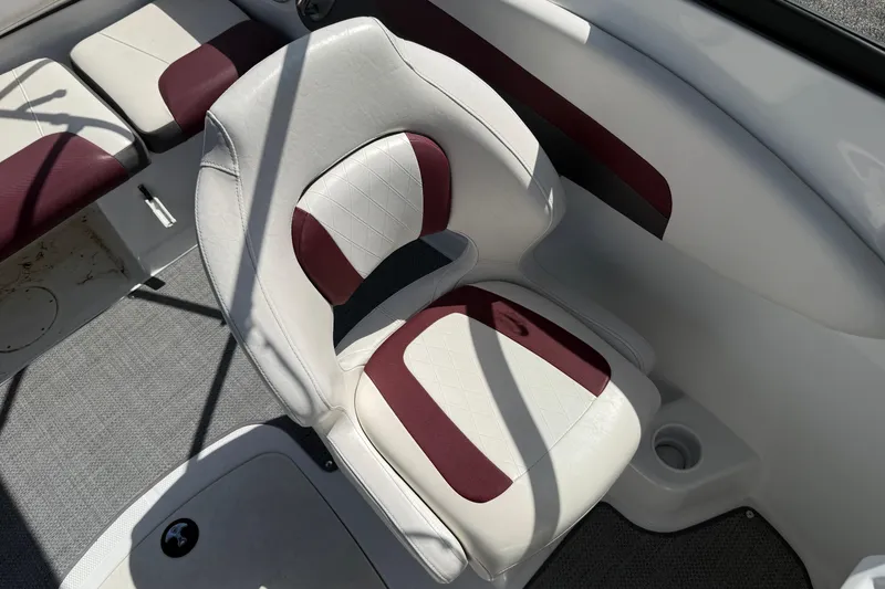 Slide: The Image of White and maroon seating in a 2020 Tahoe 500 TS boat interior. - 13