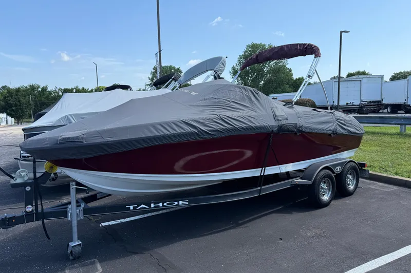 Slide: The Image of 2020 Tahoe 500 TS boat with cover on trailer in parking lot. - 28
