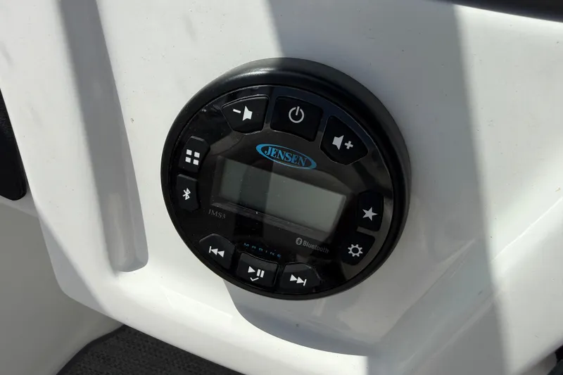 Slide: The Image of Jensen marine audio system on 2020 Tahoe 500 TS boat dashboard. - 26