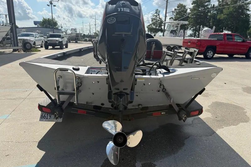 Slide: The Image of 2018 Ranger RT188C boat with outboard motor on trailer, parked outdoors. - 5
