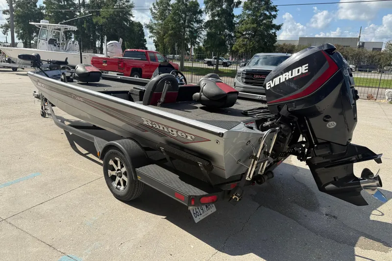 Slide: The Image of 2018 Ranger RT188C boat with Evinrude motor on trailer in parking lot. - 4